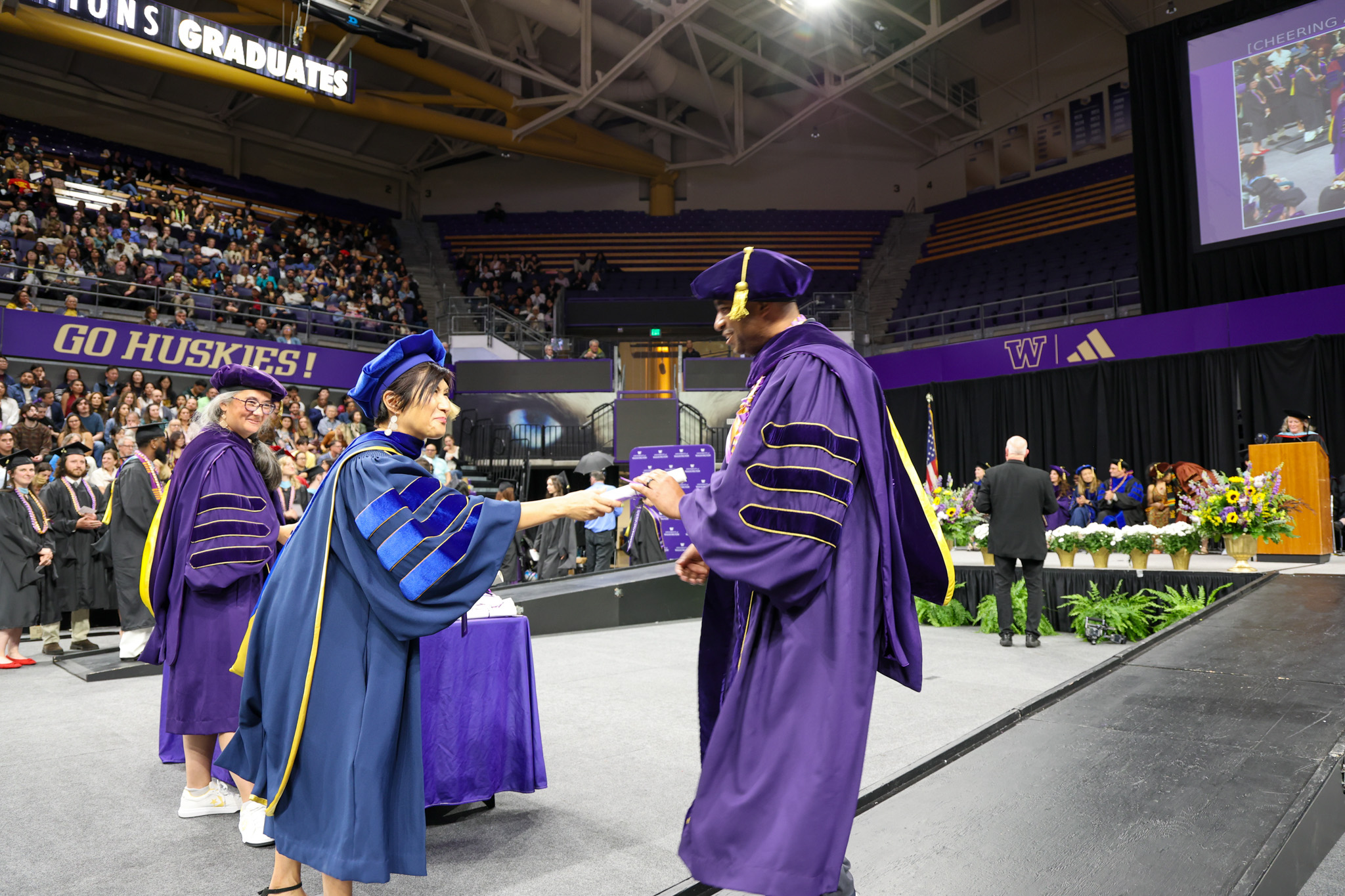 dean handing out diplomas