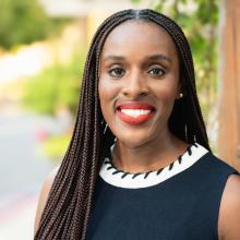 Headshot of Lakeya Afolalu, smiling.