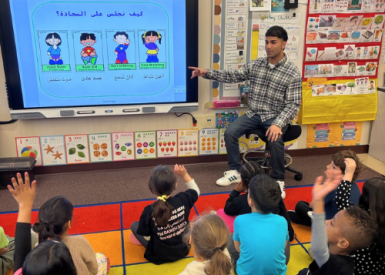 Zain Suleman teaching children in a classroom