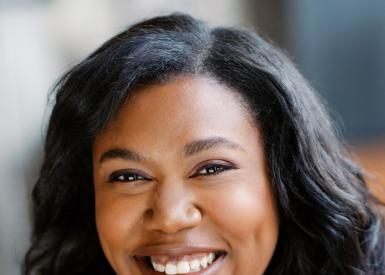 A portrait of Melyssa Stone smiling