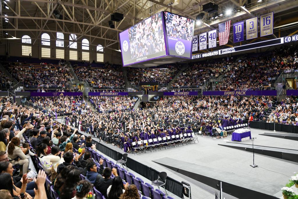 Image of the graduates and crowd at graduation